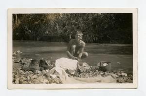 Primary view of object titled '[Photograph of Soldier Washing Clothes]'.