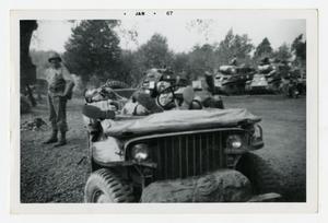 [Photograph of Soldiers Sleeping in Jeep]