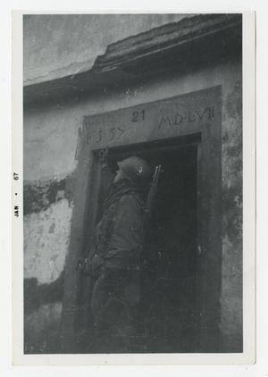 Primary view of object titled '[Photograph of Soldier in Doorway]'.