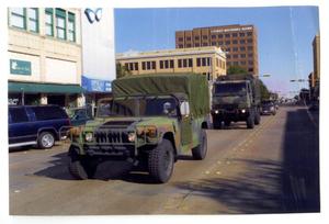 [Several World War II Trucks in Dedication Parade]