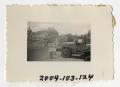 Photograph: [Photograph of Army Truck in German City]