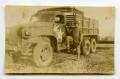 Photograph: [Photograph of Soldier with Truck]