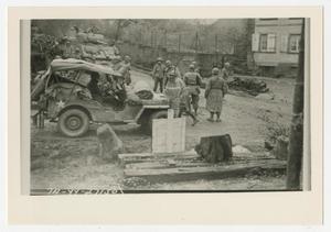 [Photograph of Soldiers with Jeep and Tank]