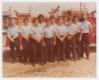 Photograph: [Firemen Standing In Front of Red Truck]