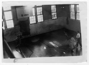 Primary view of object titled '[Young Men Playing Basketball Indoors at Fretz Park]'.