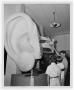 Photograph: [Young Men Examining Inner Ear Model at the Museum of Natural History]
