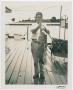Thumbnail image of item number 1 in: '[Henry S. Clountz Holding Catfish]'.