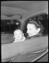 Primary view of [Woman in Car Holding Child]