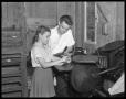 Primary view of [Man and Girl at Printing Press]