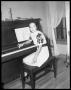 Photograph: [Mrs. O. P. Hodges at Piano]