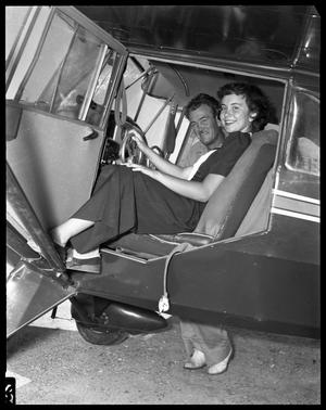 [Woman and Man in Small Plane]