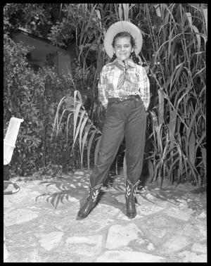Primary view of object titled 'Young Girl with Pigtails Dressed as a Cowgirl'.