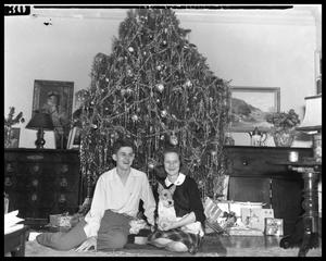 [Man and Woman with Dog at Christmas Tree]