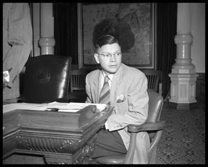 Young Man Seated at Desk