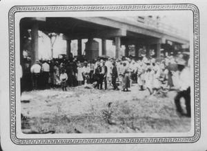 [Brazos River Bridge opening ceremonies celebration. Large group of people standing under bridge.]