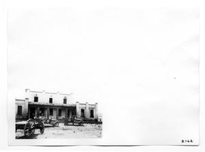 Primary view of object titled '[U.S. Army Personnel in Front of Building]'.