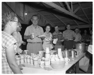 [Lyndon and Lady Bird Johnson Standing in an Outdoor Food Line]