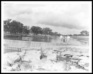 [Johnson Family  and a Man Standing on a Dam and Spillway]