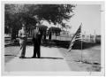 Photograph: [Two Men Standing on a Dirt Path]