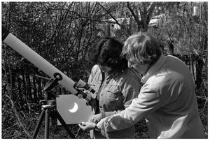 [Two People Viewing Images of a Solar Eclipse]
