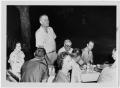 Photograph: [Lyndon Johnson Standing Among Picnickers]