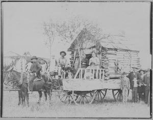 [Photograph of Horse-Drawn Cabin]