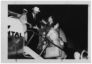 [Lyndon B. Johnson, Lady Bird, and Others Exiting From an Airplane]