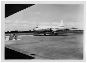 Primary view of object titled '[Airplane on a Runway Near a Gas Pump]'.