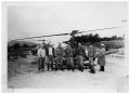Photograph: [Men in Front of a Helicopter]