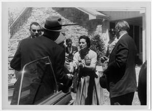 [Lady Bird Johnson with Men Outside of the Texas White House]
