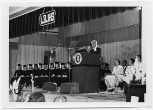 Primary view of object titled '[Lyndon Johnson Speaking at a High School Graduation]'.