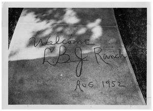 ["Welcome LBJ Ranch Aug 1952" on a Concrete Sidwalk]