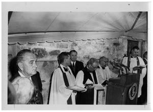 [Lyndon Johnson with Clergymen at a Podium]
