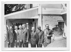 [Lyndon Johnson Standing with a Row of Men]