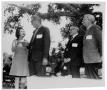 Primary view of [Lady Bird Johnson Giving a Card to a Man]