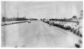 Photograph: [Cars Parked Along an Open Road]