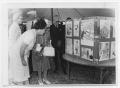 Photograph: [Lady Bird Johnson and Others Examing a Display]
