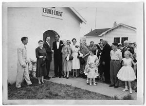 Primary view of object titled '[People Standing Outside the Church of Christ]'.