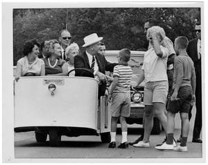 [Lyndon Johnson Driving a Three Wheeled Cart]