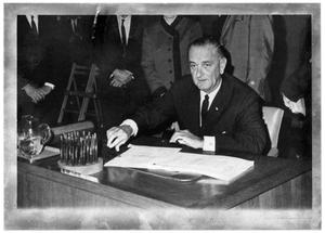 [Lyndon B. Johnson Sitting at a Desk]
