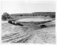 Photograph: [Industrial Vehicles around a Pond]