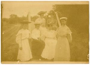 [A Group of Women Posed by a Bridge]