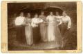 Photograph: [Seven Women with Umbrellas and a Deer]