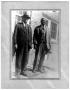 Primary view of [Two Men in Front of a House]