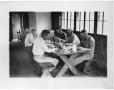 Primary view of [Five Men at an Indoor Picnic Table]