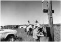 Thumbnail image of item number 1 in: '[Watt Matthews on the Phone at the Airstrip near White Flat]'.