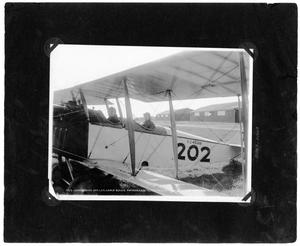 Primary view of object titled '[Two men in Biplane at Love Field]'.