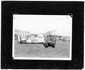 [Two Commanding Officers in Front of a Biplane at Love Field]