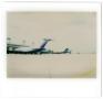Photograph: [Dallas/Fort Worth Airport: Several Airplanes Attached to Jetways]