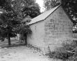 Photograph: [Kusenburg-Petsch House, (Southwest oblique of smokehouse)]
